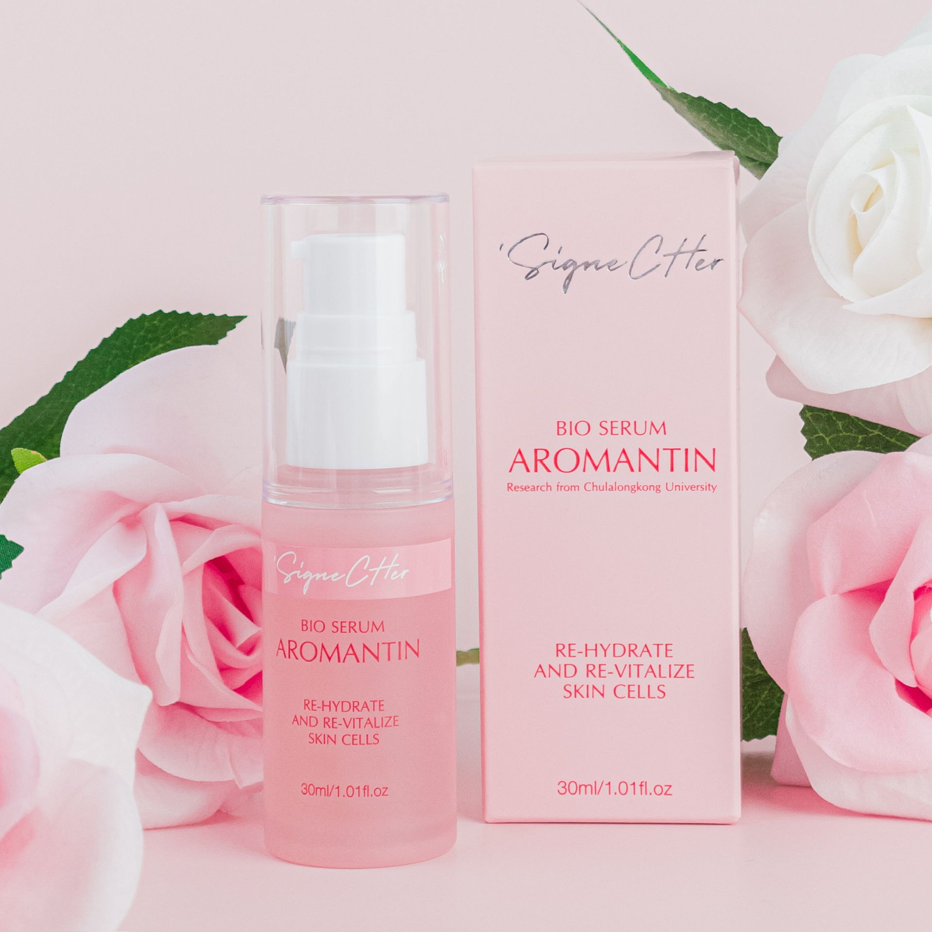 A bottle of aromantin sits next to a box of aromantin bio serum