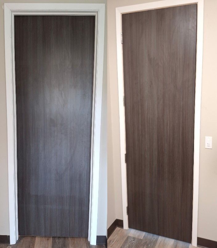 Two interior doors with dark wood panels and white trim, side by side in a hallway