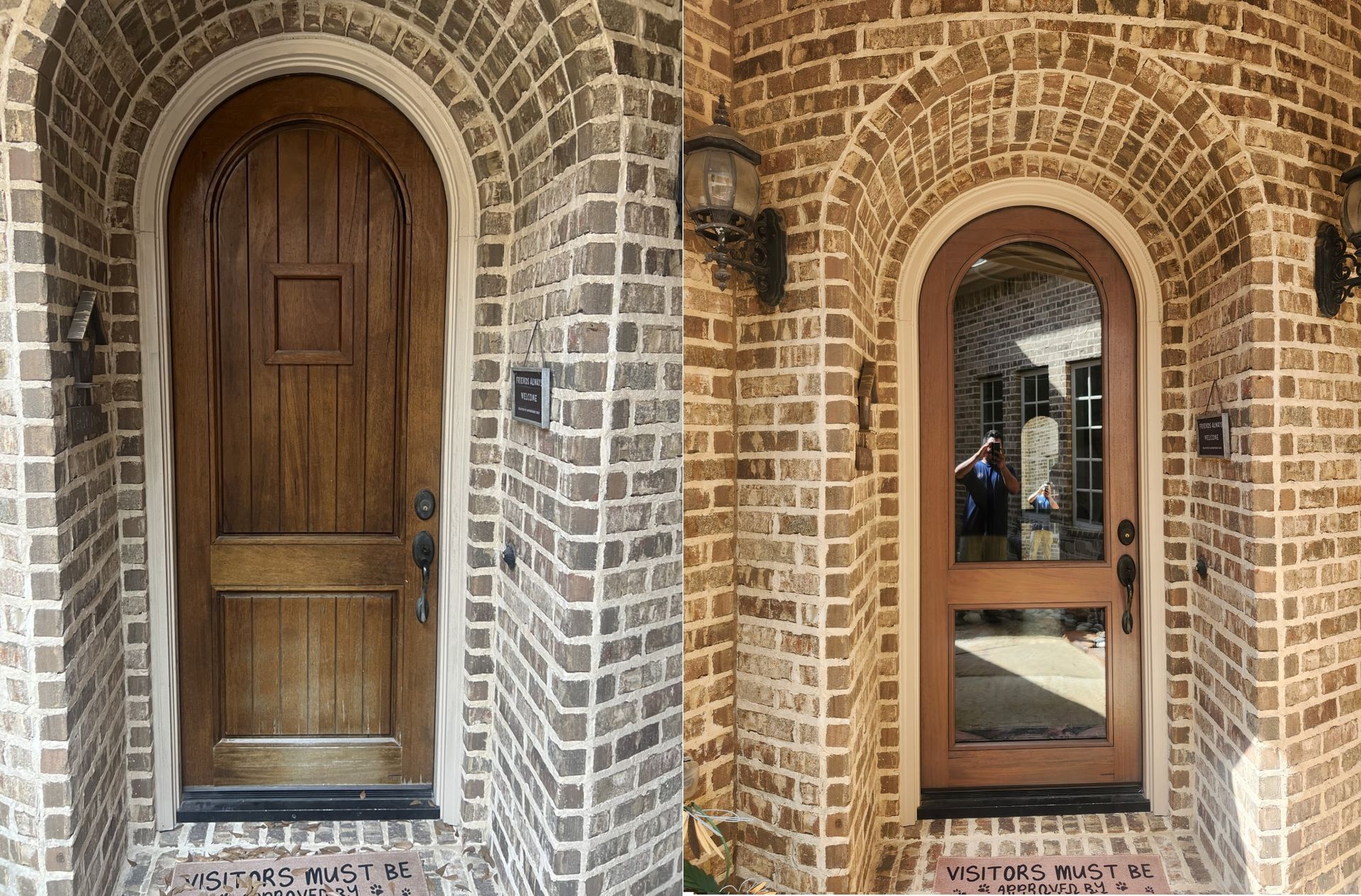 Brick building facade with arched wooden doors and a window with a person reflected in the glass