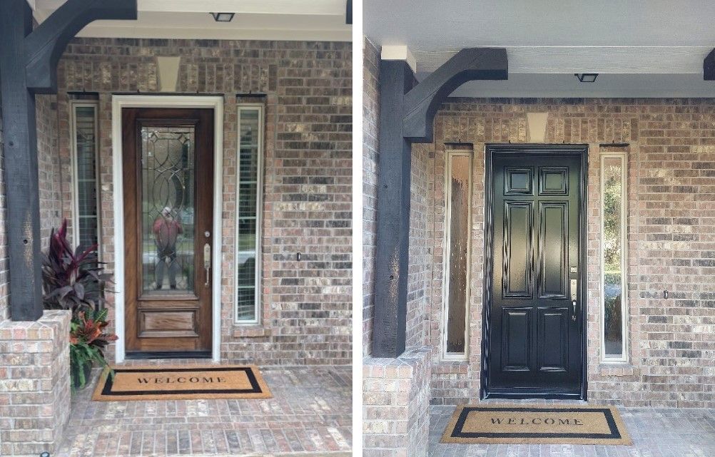 Two front doors on a brick porch, one wood and one dark green, each with a doormat.