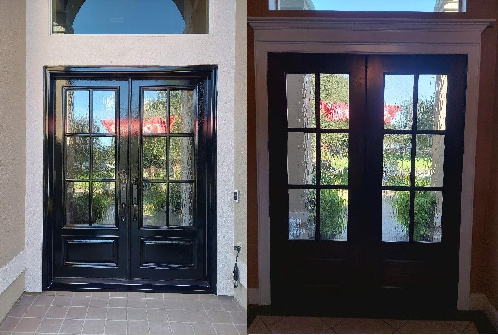 Two black double glass doors under arched transoms, with daylight and greenery visible through the panes.