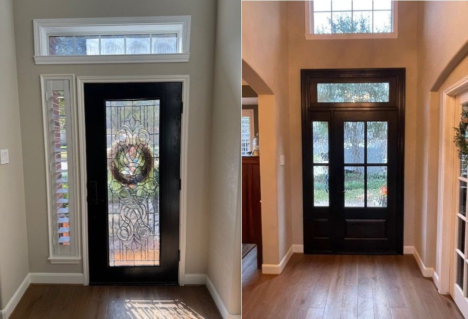 Two dark front doors with frosted glass sidelights and transom windows in a foyer