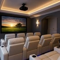 A home theater with a projector and a large screen.