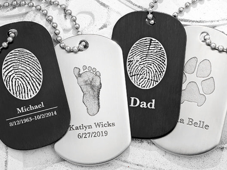 A group of dog tags with a fingerprint on them
