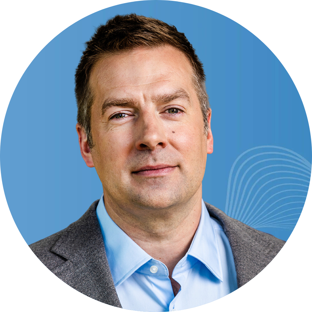 A man in a suit and blue shirt is in a blue circle