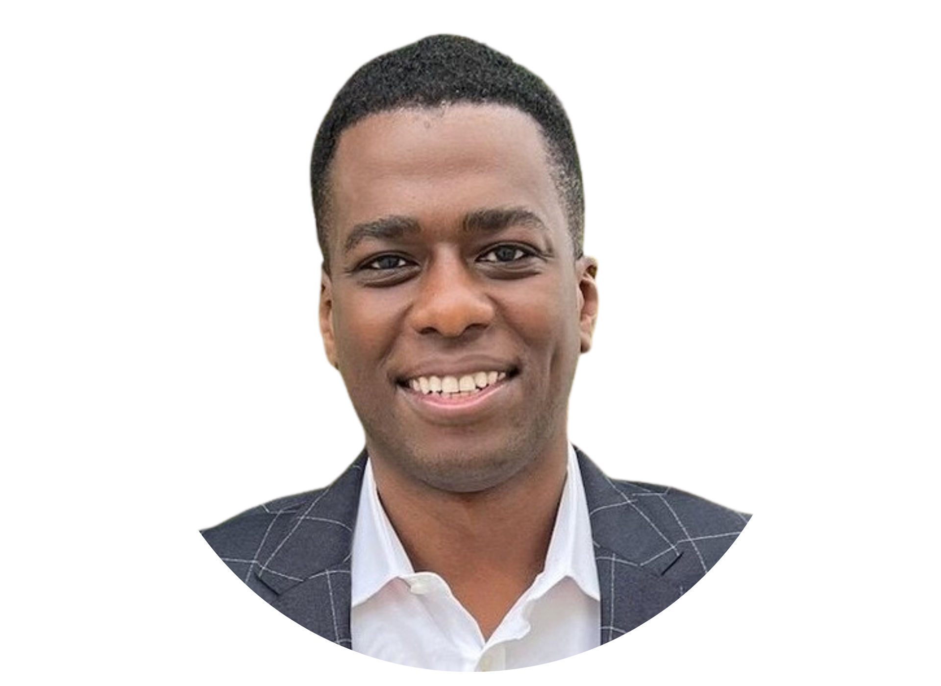 A man in a suit and white shirt is smiling for the camera.