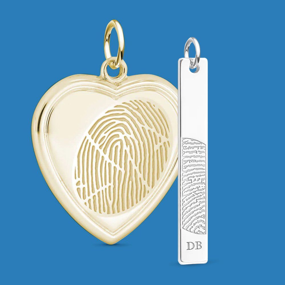 A heart shaped pendant with a fingerprint inside of it