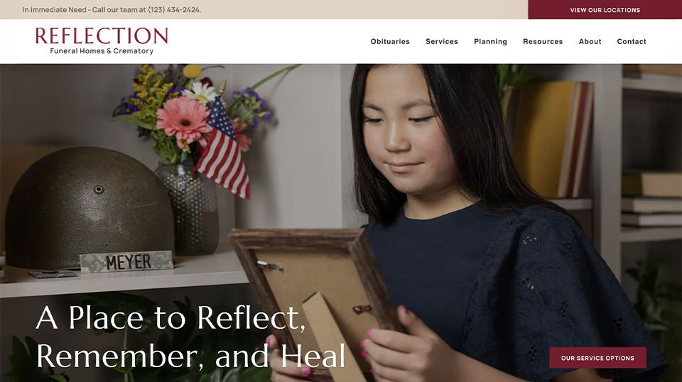 A girl is holding a picture frame on a reflection website.