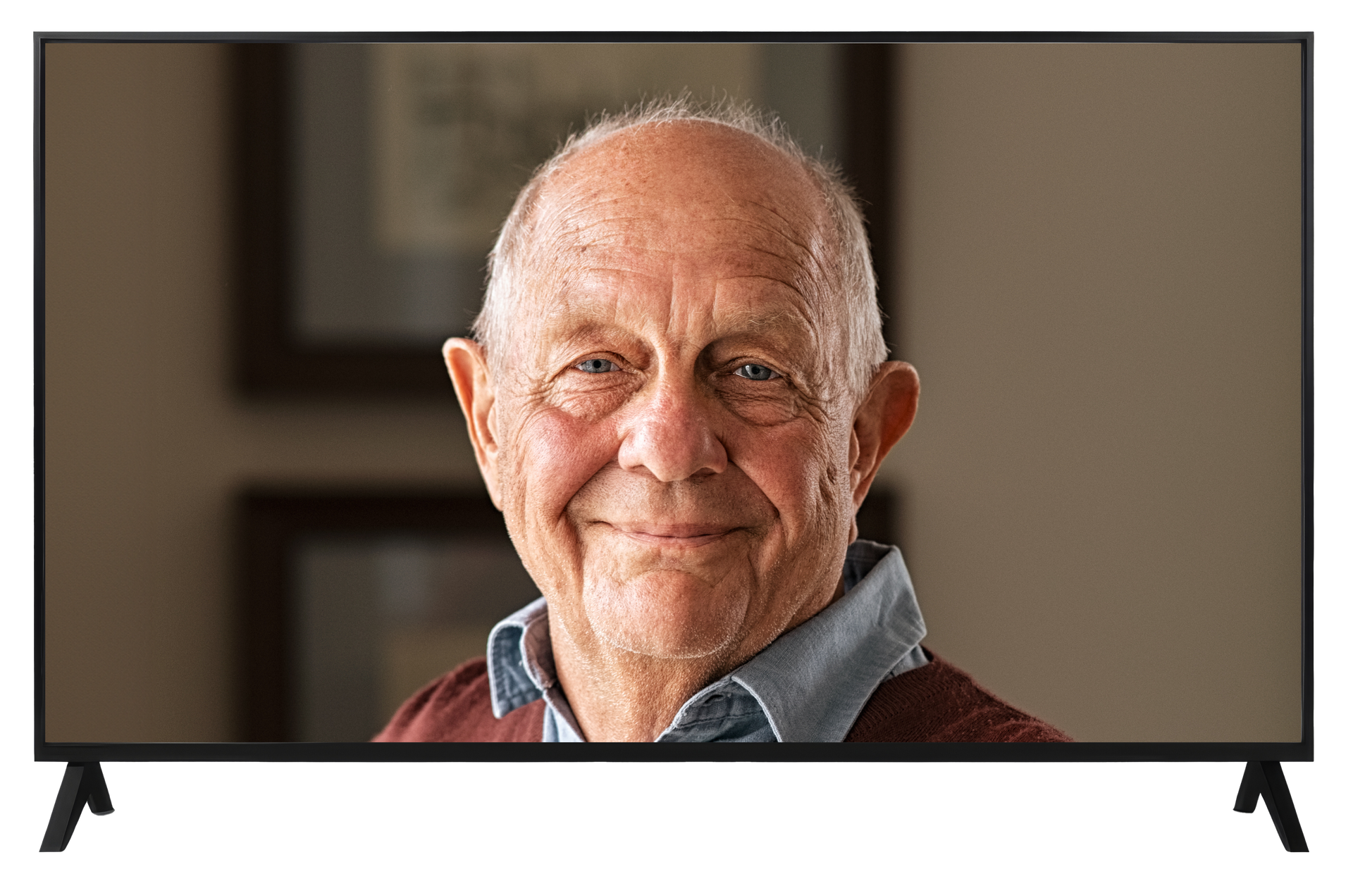 An elderly man is smiling on a television screen.