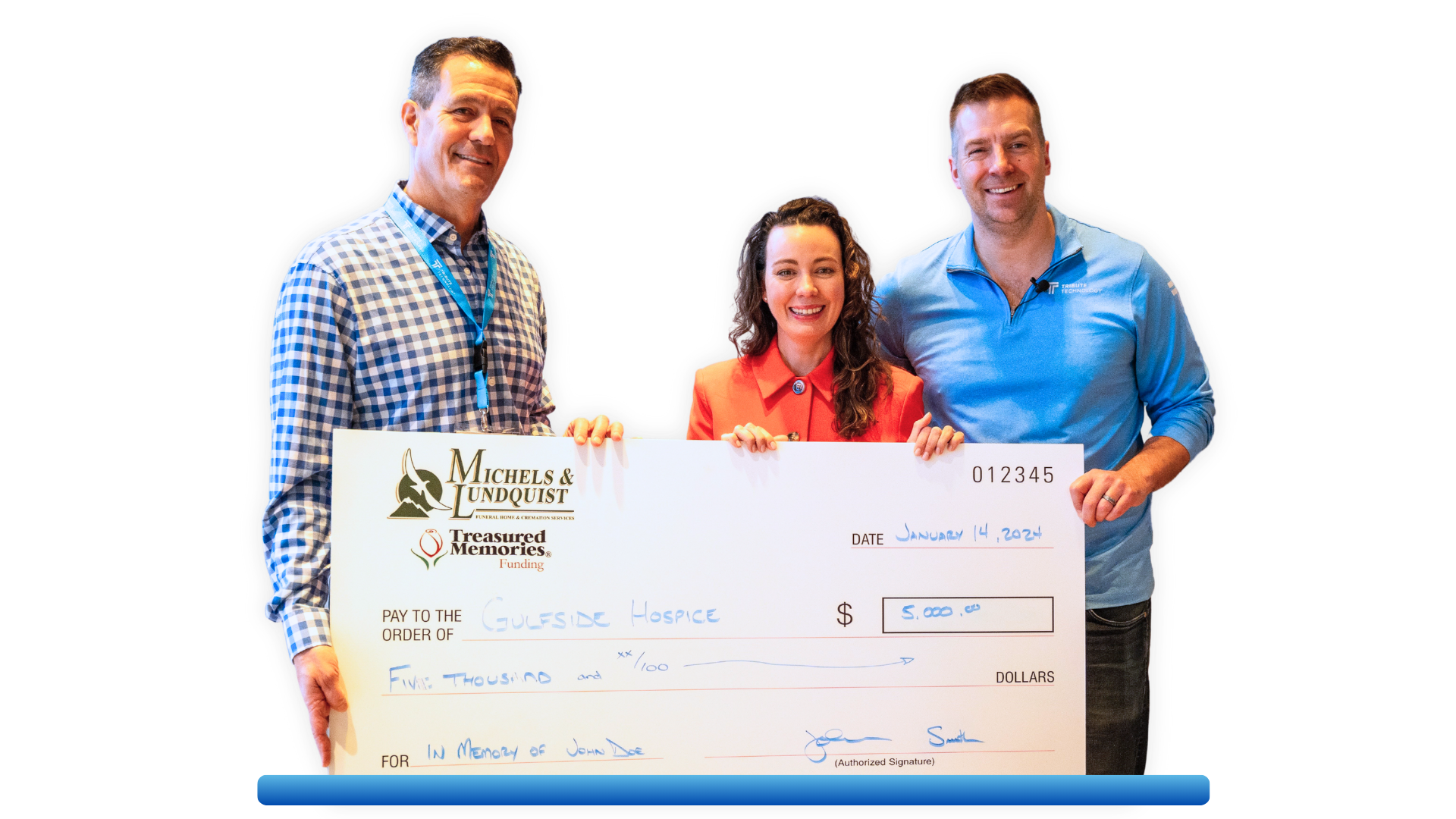 Two men and a woman are holding a large check.