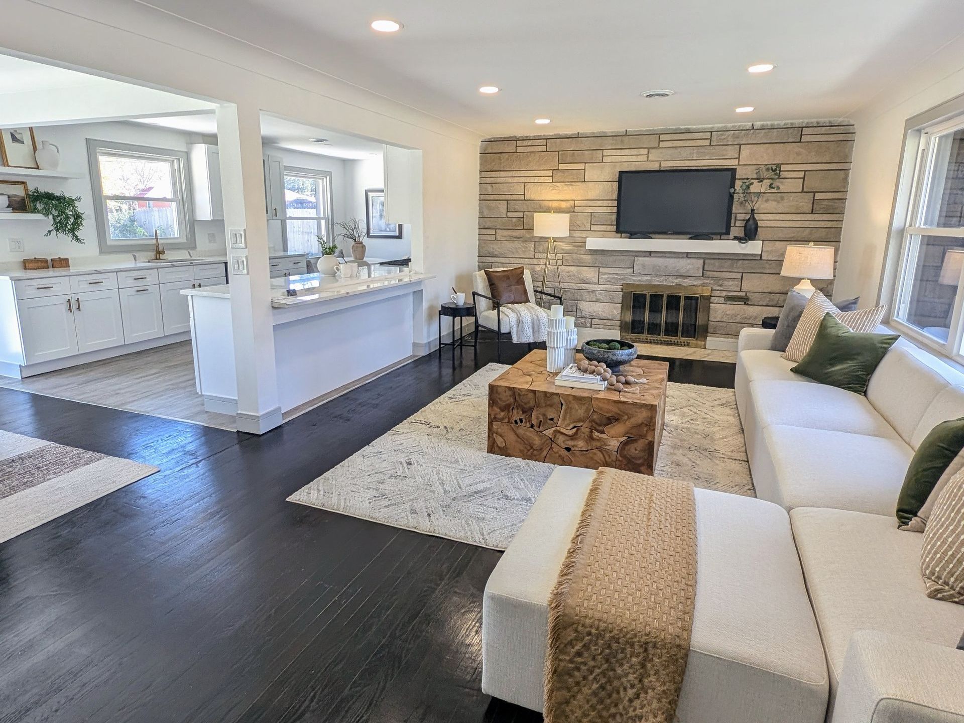 A living room filled with furniture and a fireplace.
