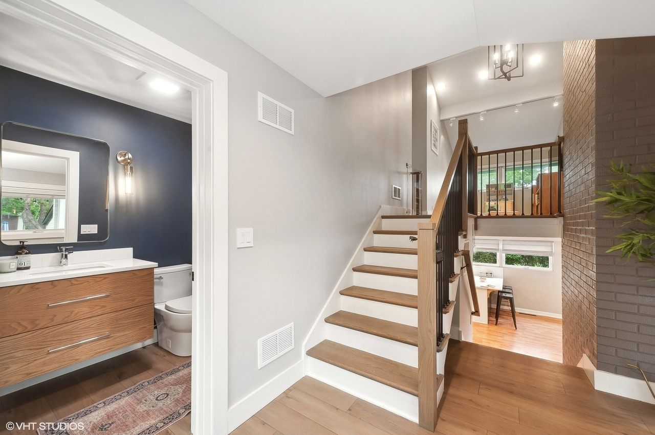 There is a staircase leading up to the second floor of a house in north shore il