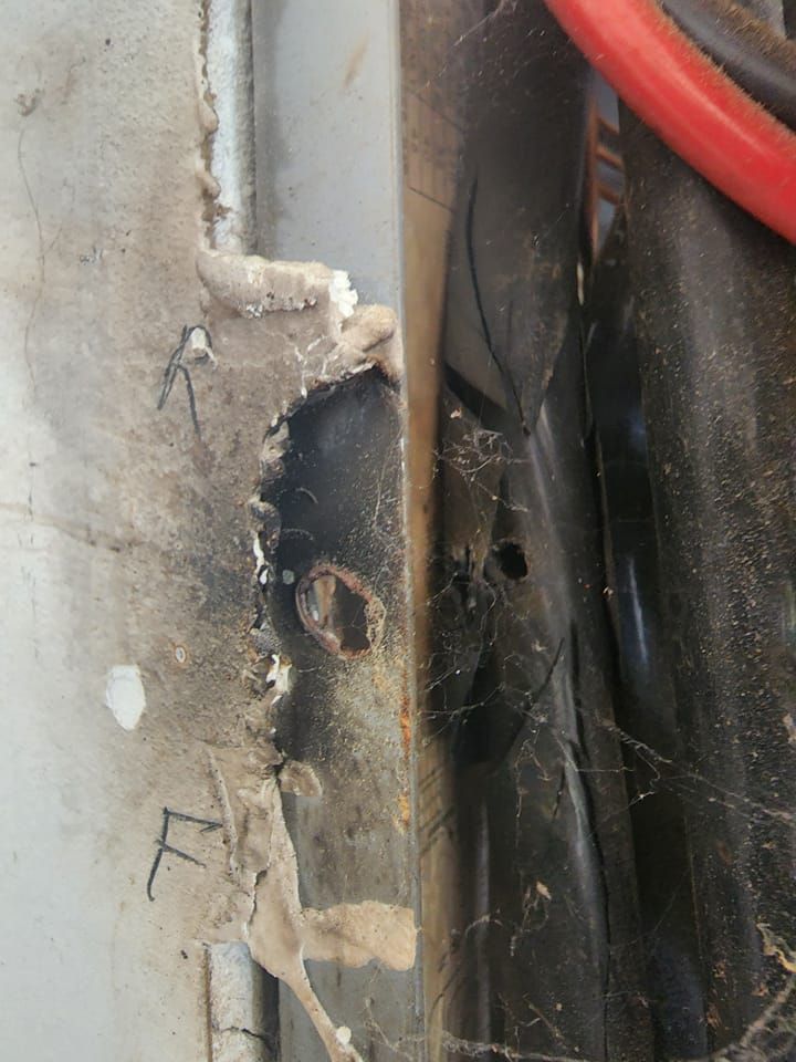 A close up of a piece of metal with a hole in it