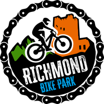 The logo for richmond bike park has a bicycle gear on it.