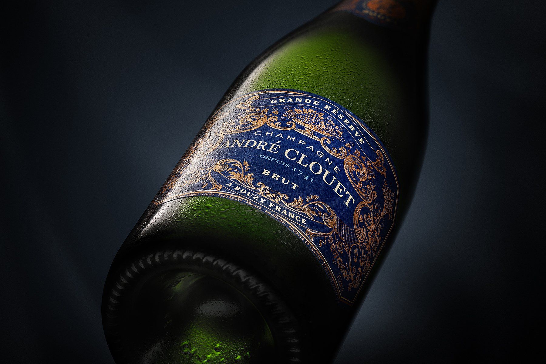 Green Champagne bottle, Andre Clouet, dark blue label with gold details, water droplets, dark background.