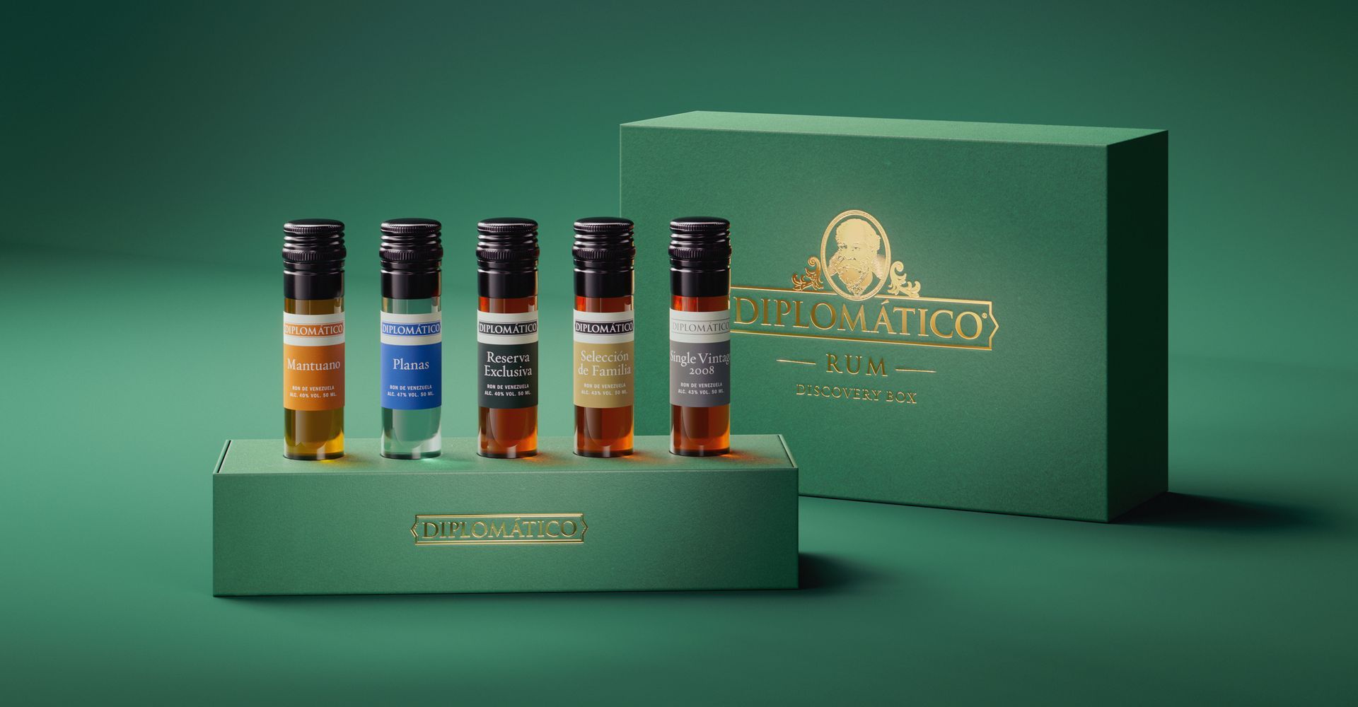 Five small bottles of liquid with labels in a green box, beside a matching box with gold text.