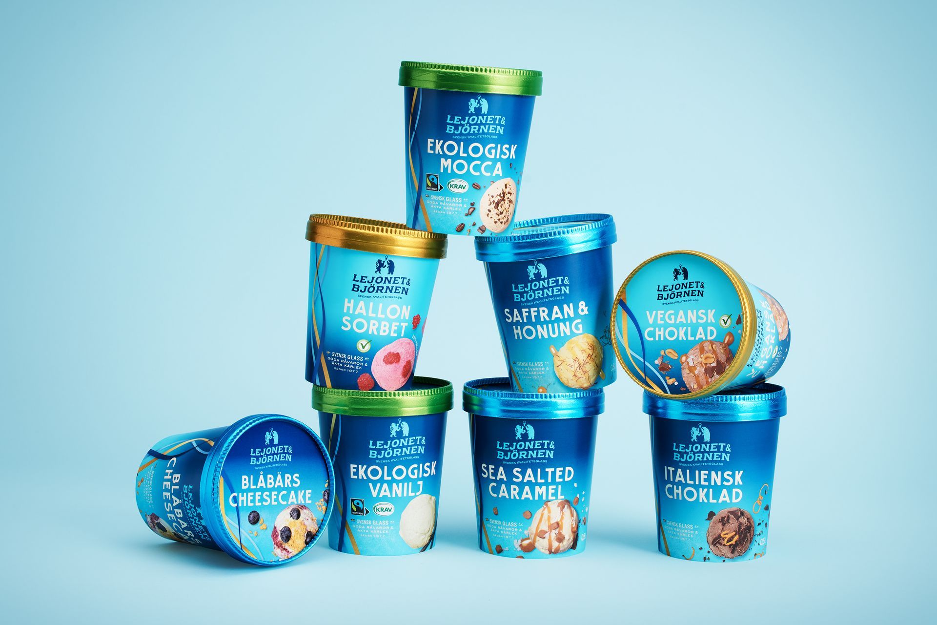 Ice cream containers, stacked pyramid shape, various flavors, blue packaging.