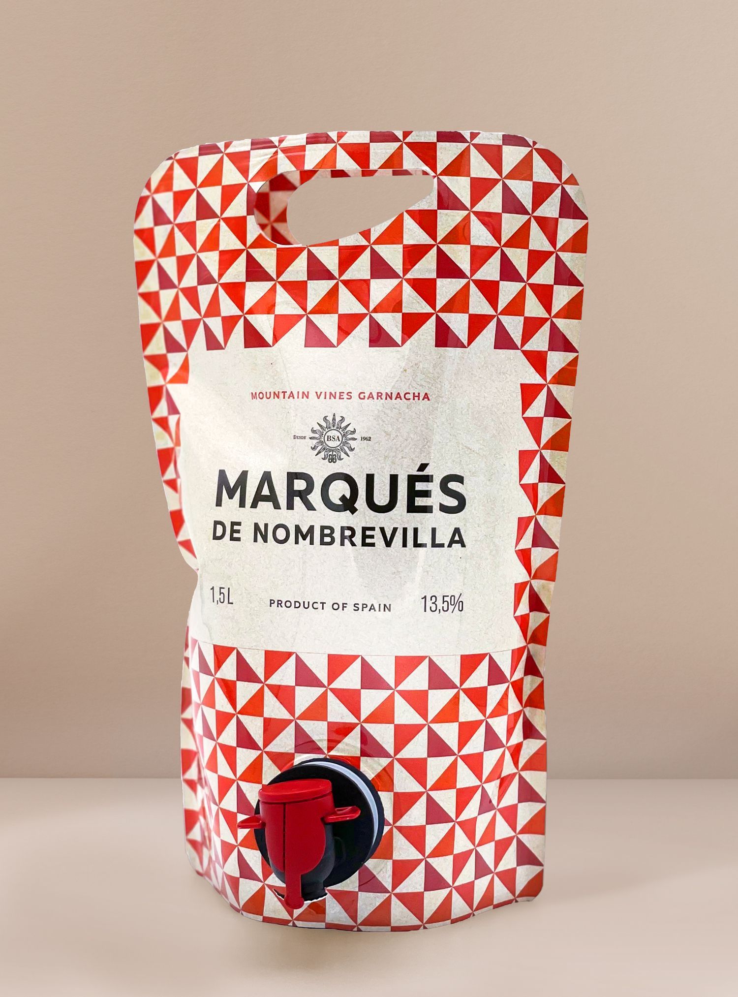 Pouch wine container with red and white geometric pattern; the label reads