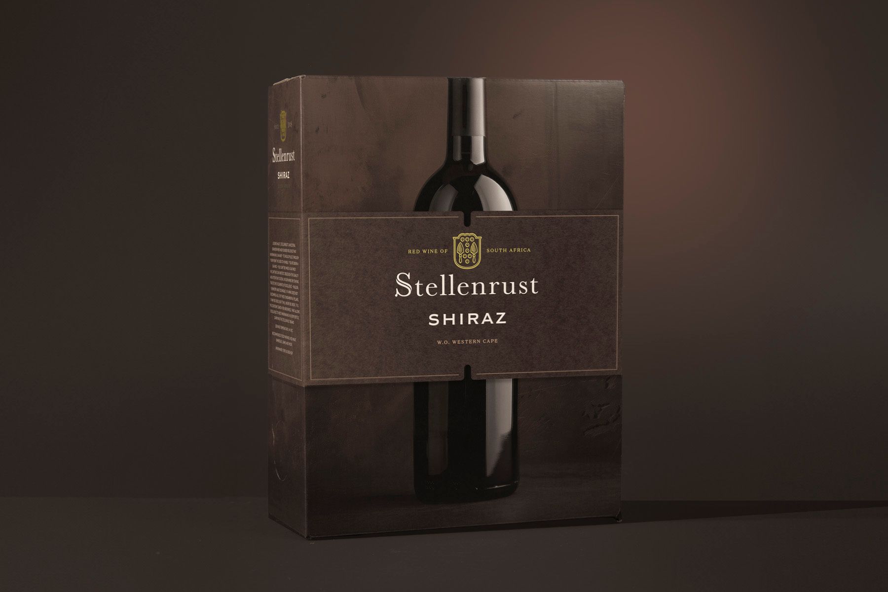 Wine bottle in a dark brown box, the label reads 