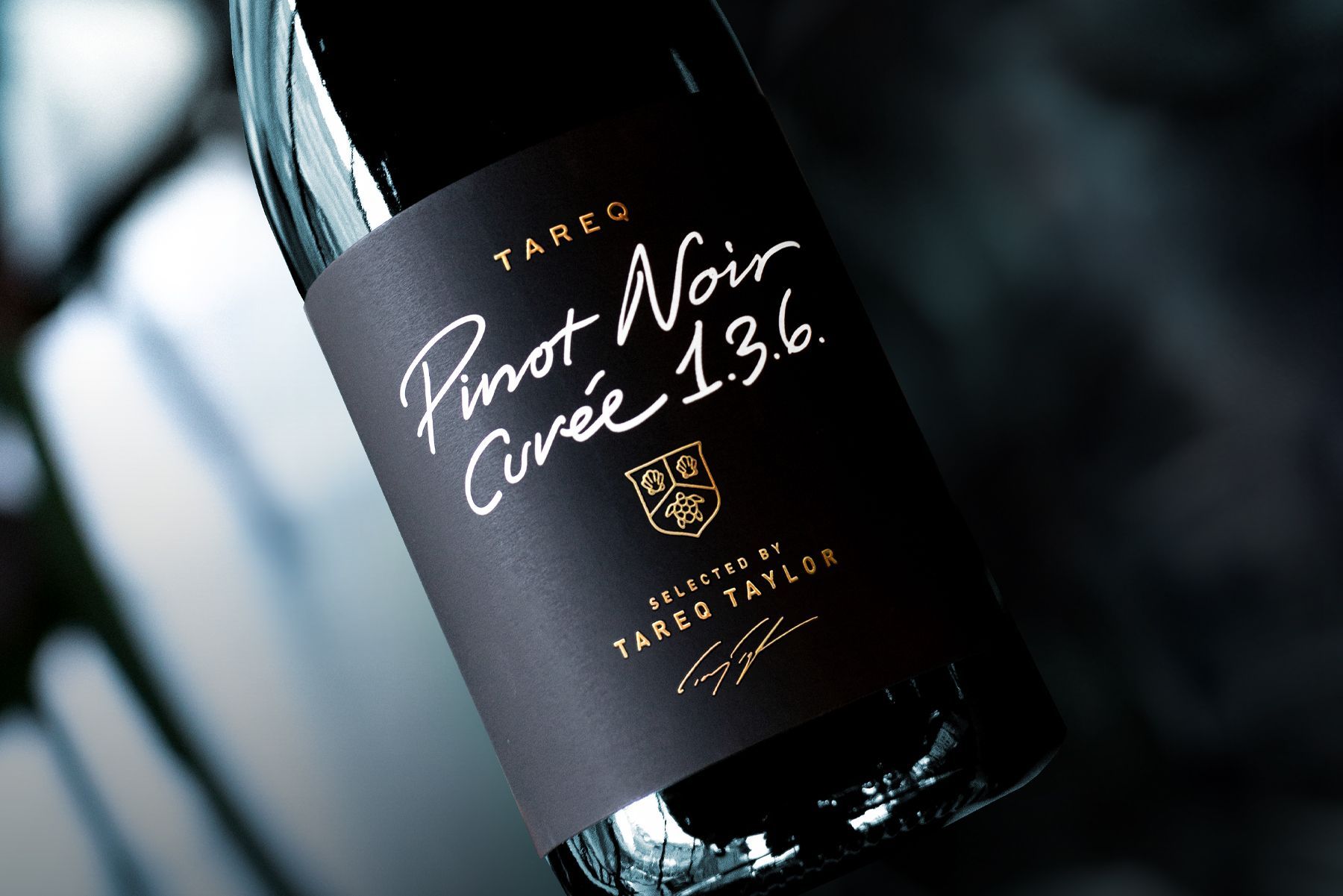 Close-up of a black wine bottle with the label 