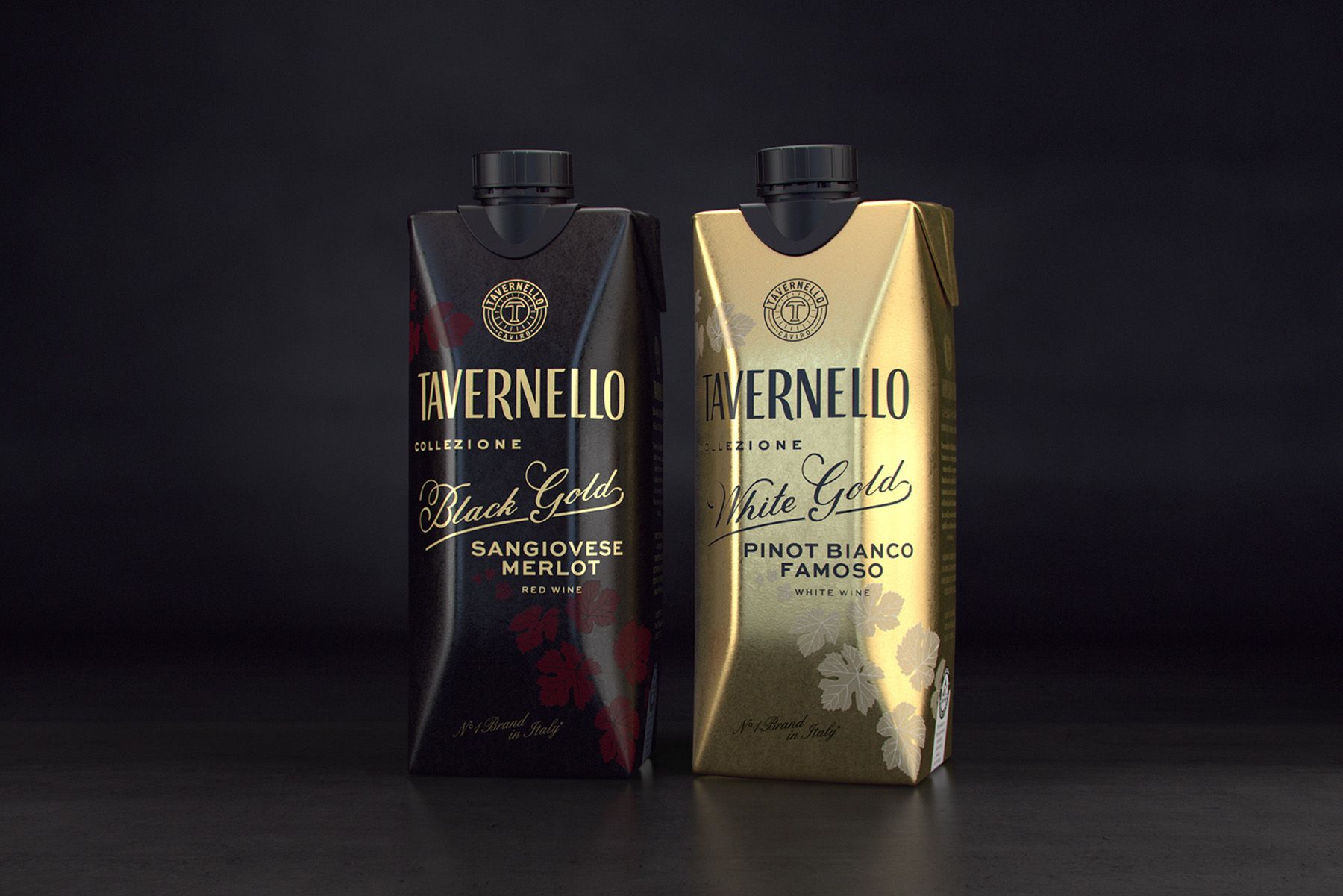 Two tetra wine cartons, Tavernello, on a dark background. Black carton reads 