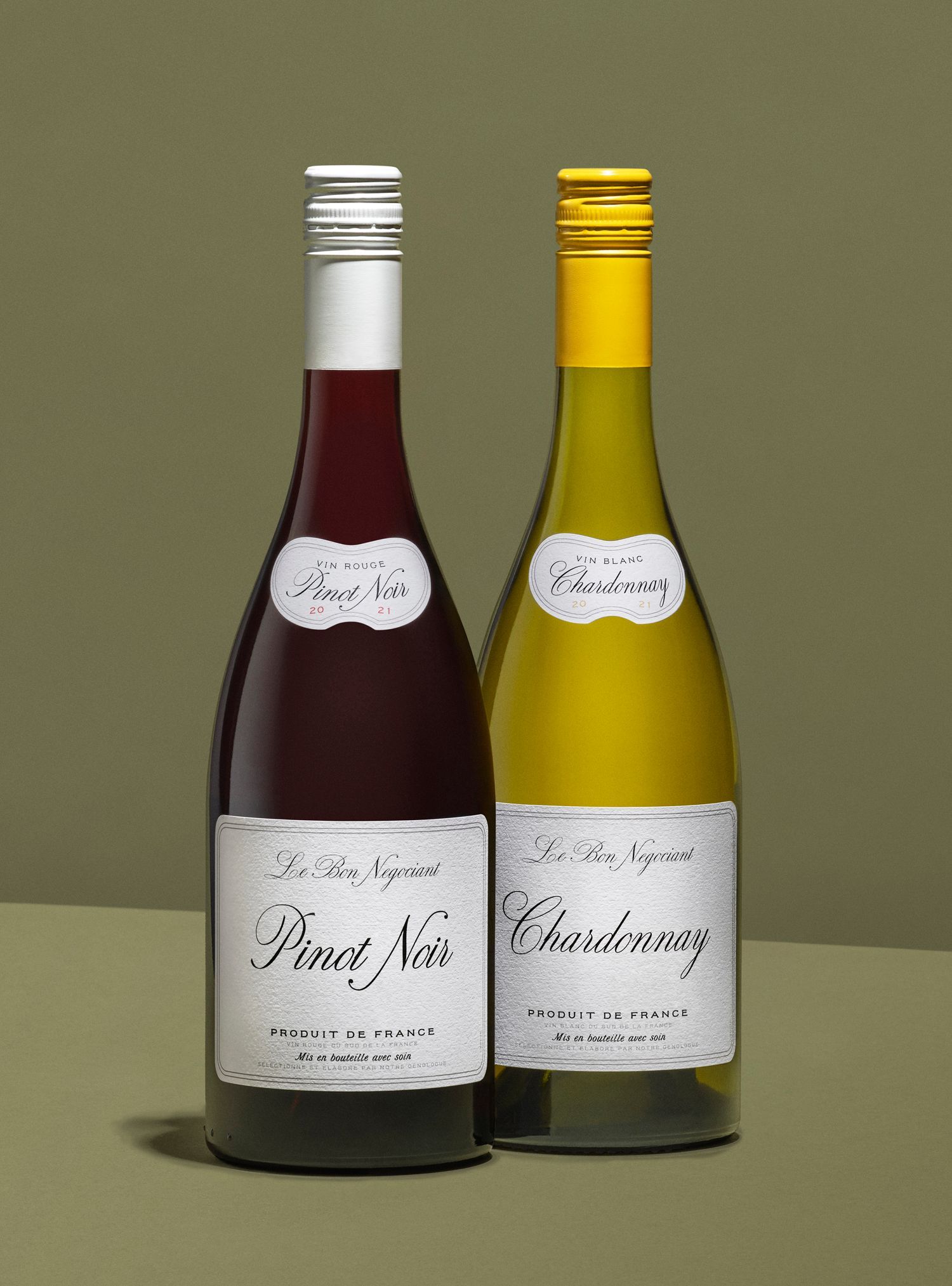 Two wine bottles: one red 