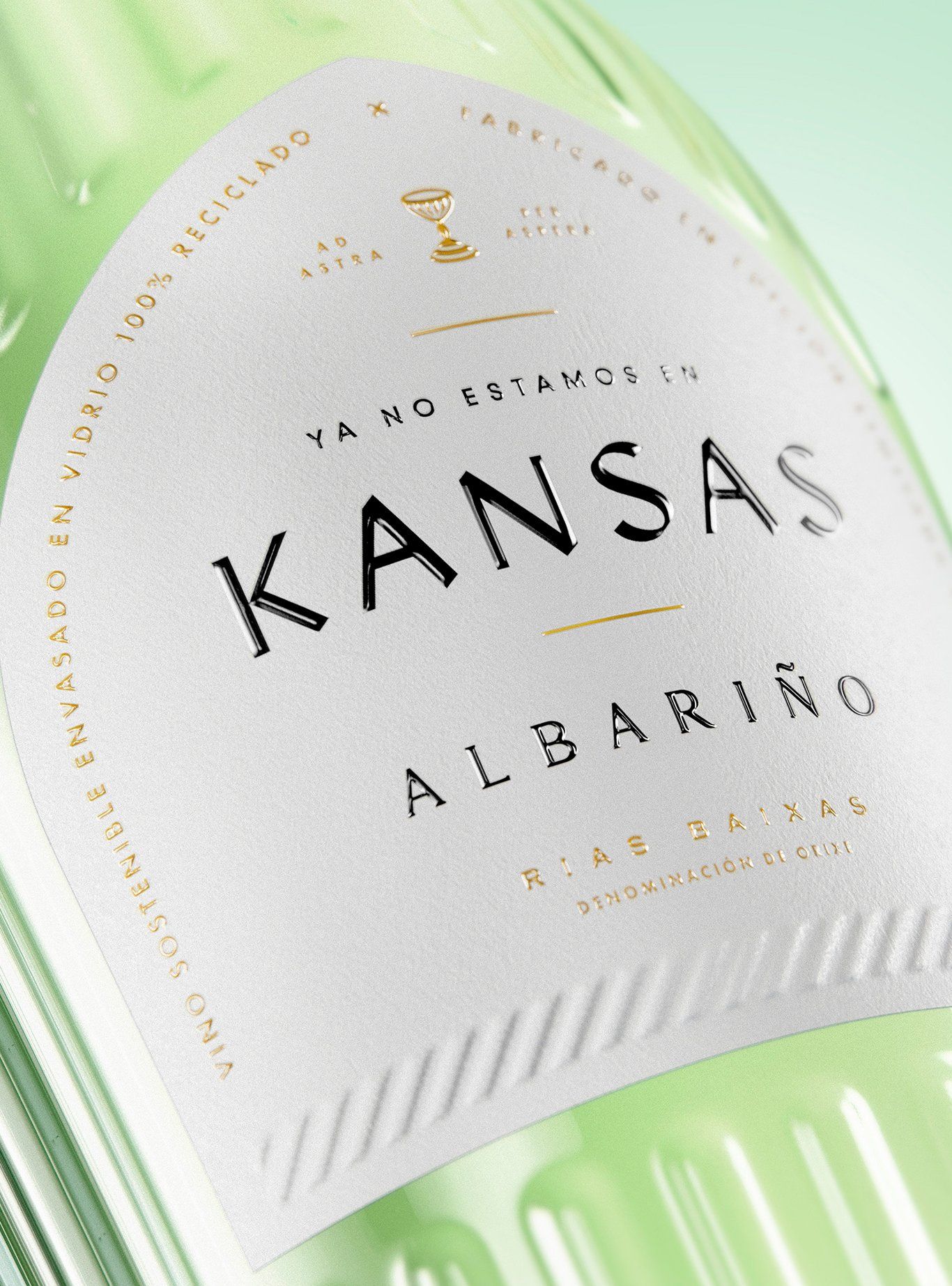 Close-up of a wine bottle label, white text on a textured label.