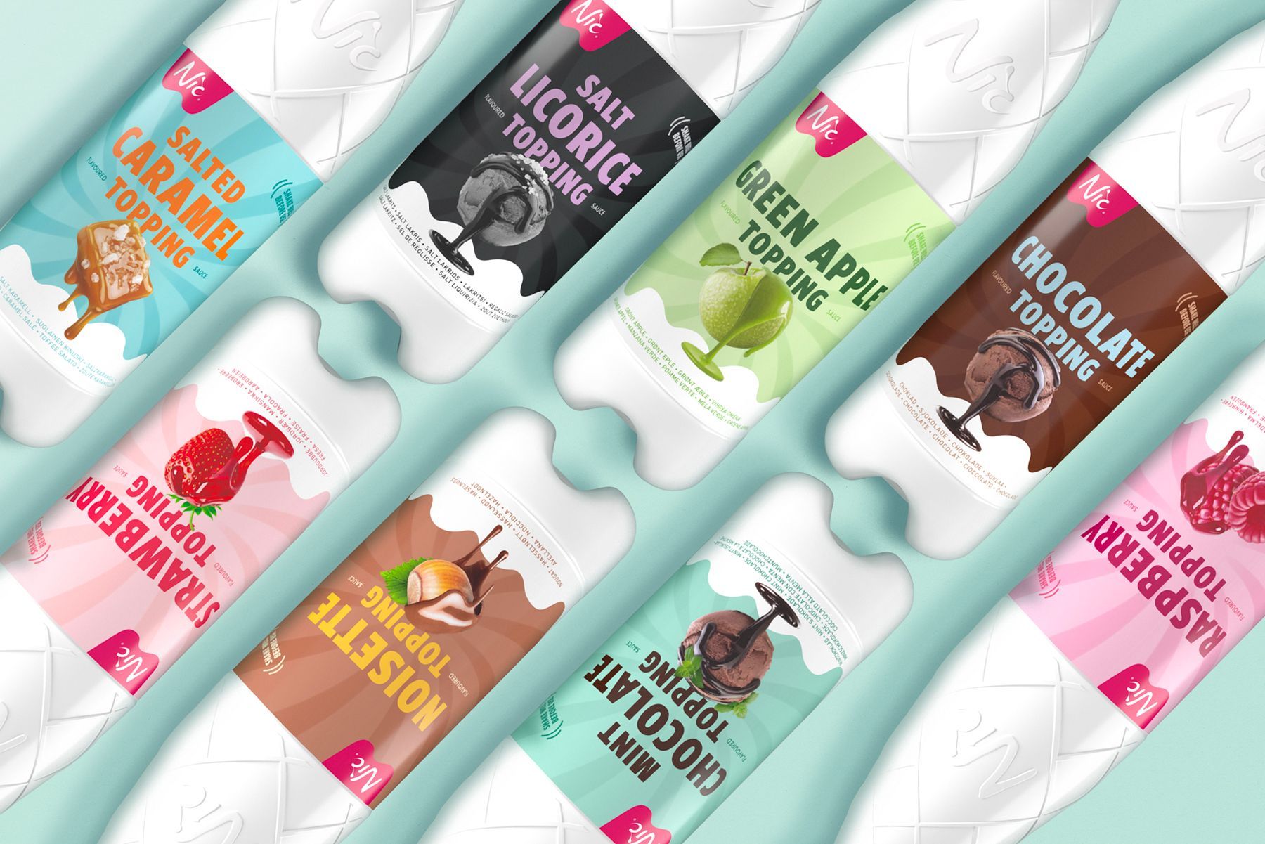 Assorted ice cream toppings in colorful bottles, including salted caramel, licorice, and mint chocolate.