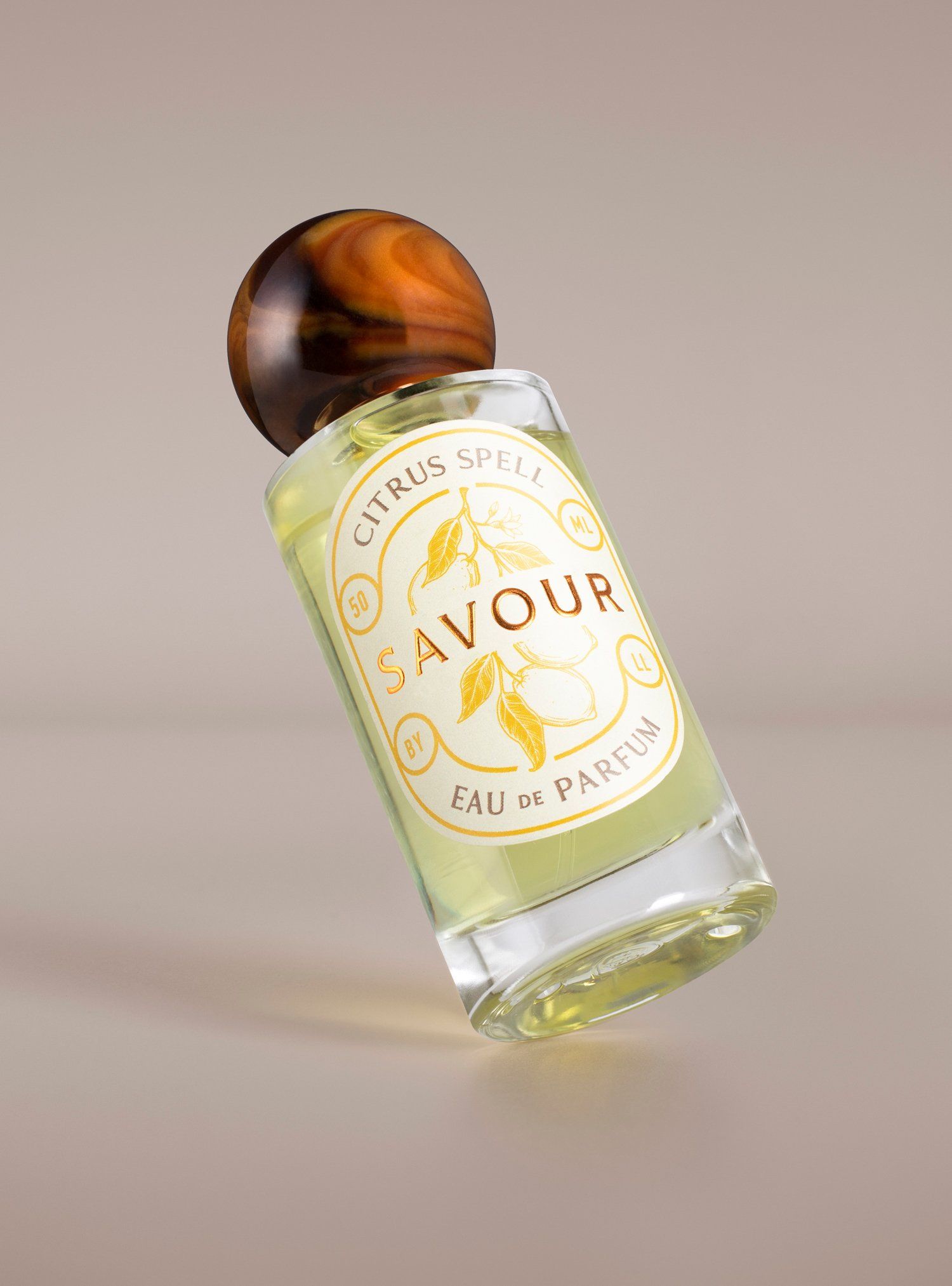 Perfume bottle tilted with wooden cap, label says