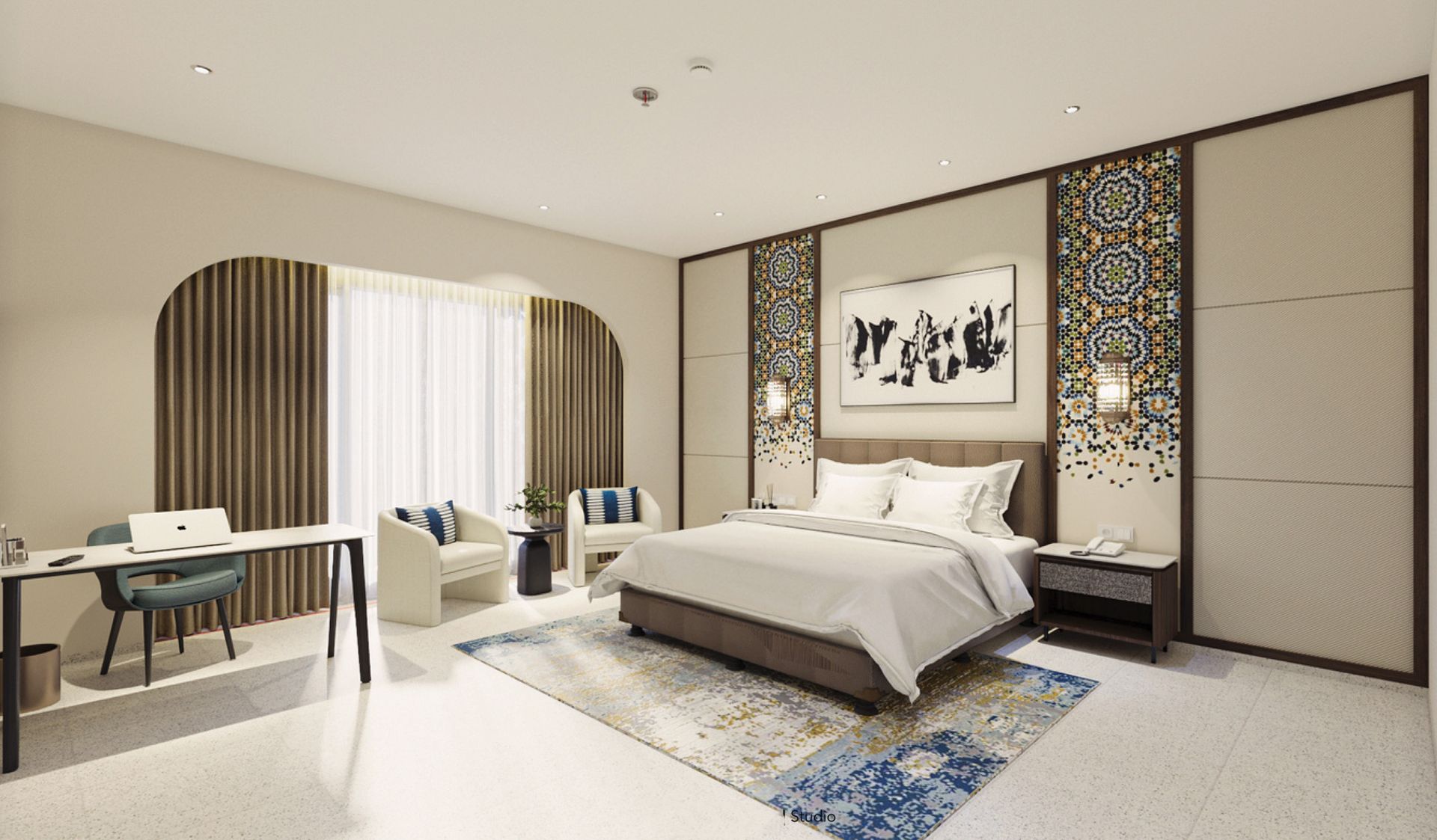 Hotel room with bed, desk, and seating. Neutral tones, decorative paneling, and patterned rug.