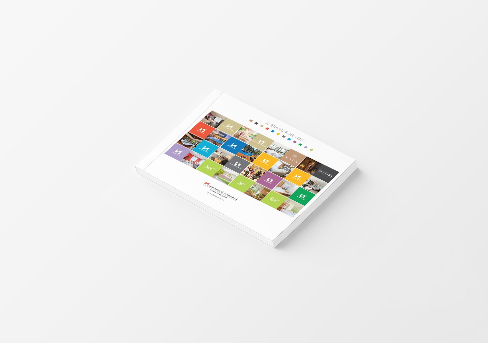 A book with a colorful grid on the cover, on a white surface.
