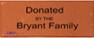 A brown sign that says donated by the bryant family