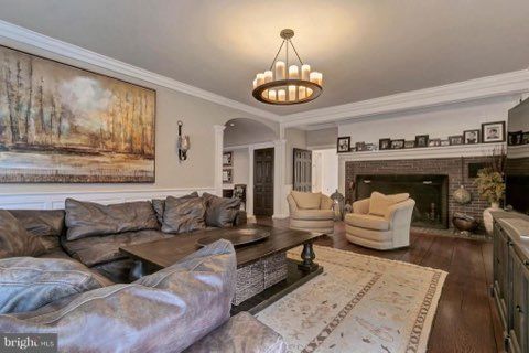 A living room filled with furniture and a fireplace.