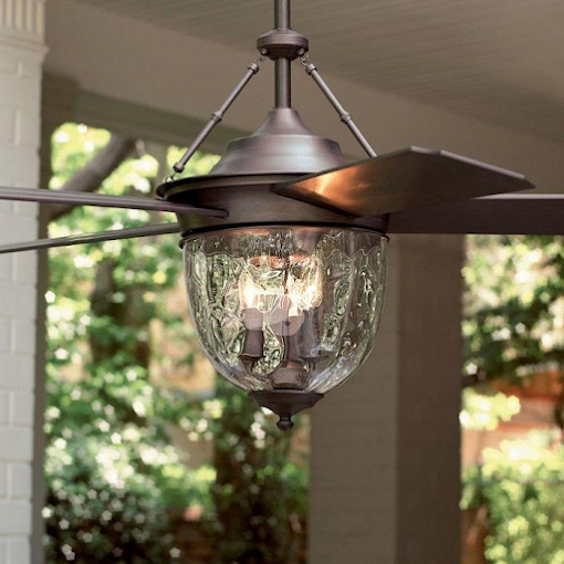 A ceiling fan with a light attached to it is hanging from the ceiling.