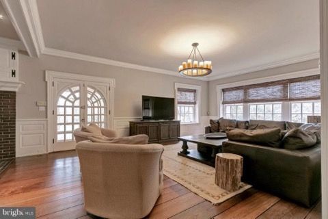 A living room filled with furniture and a television.