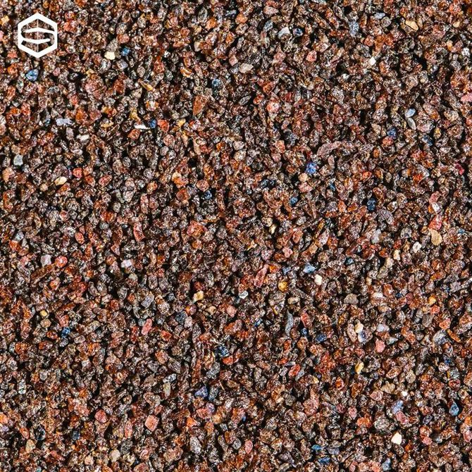 Primo piano di materiale granulare marrone dall'aspetto maculato.