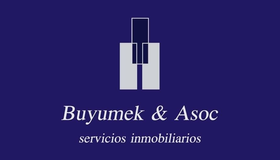 Logo de Buyumek & Asoc, servicios inmobiliarios, sobre fondo azul oscuro y figuras geométricas blancas.