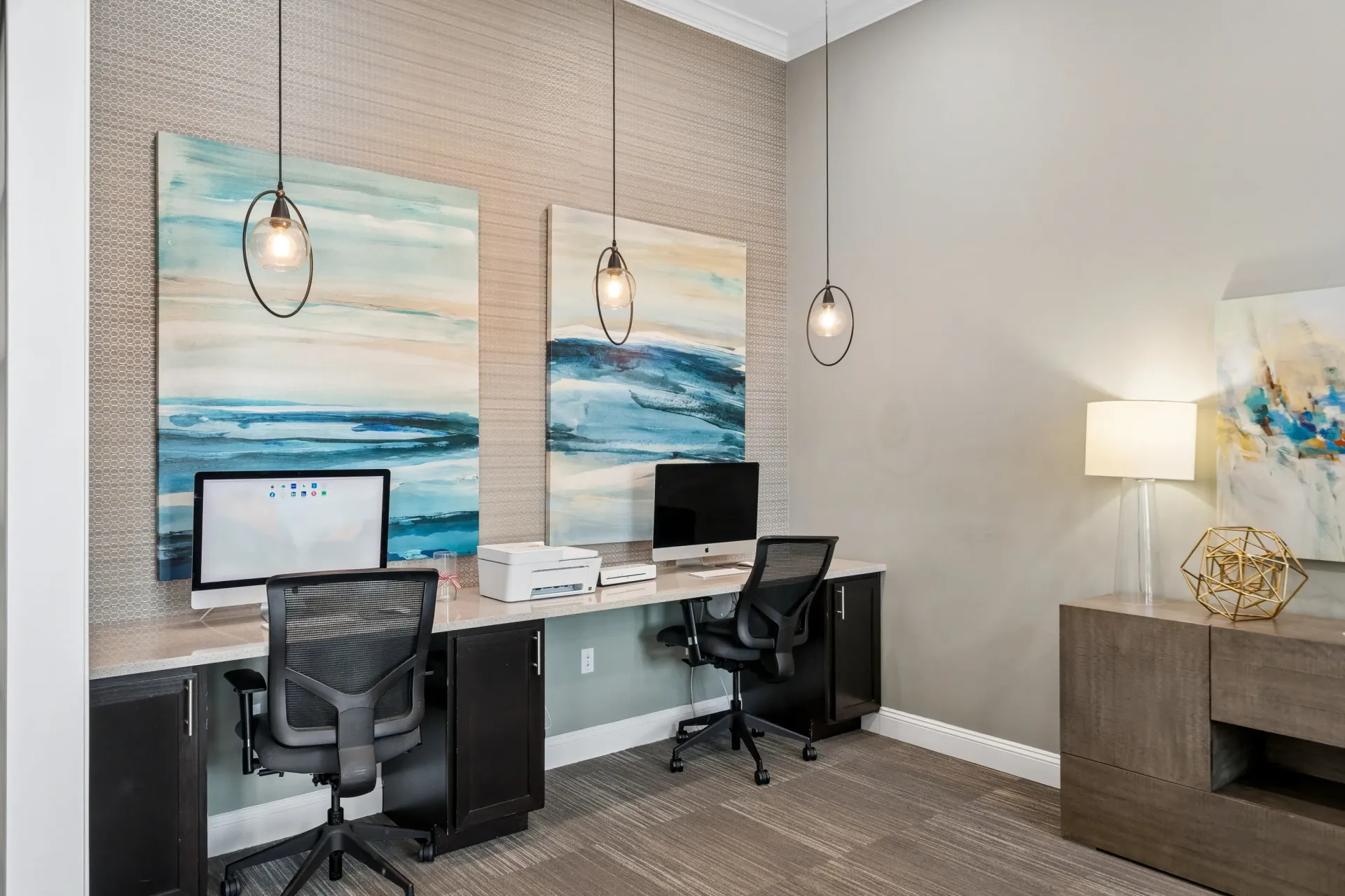 Business center with two computers and a printer at Atlantic on the Avenue in North Charleston, SC.
