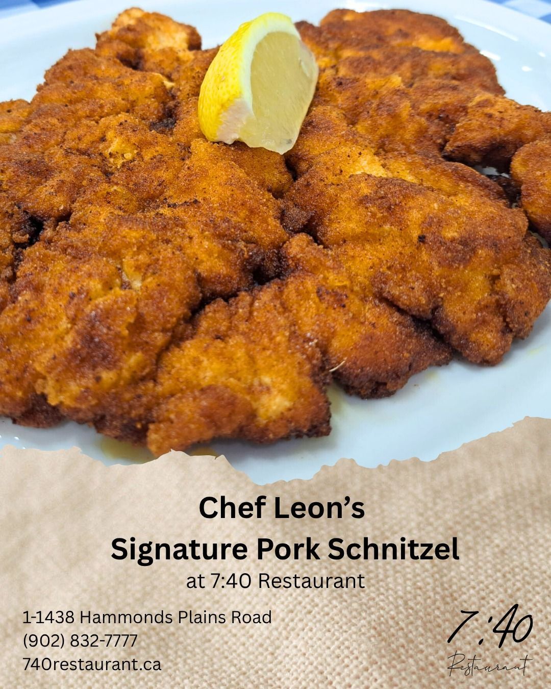 Chef Leon's Signature Pork Schnitzel on a plate with a lemon slice, at 7:40 Restaurant.