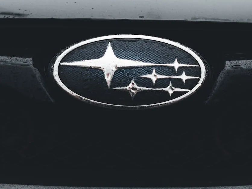 Subaru emblem on a black vehicle grille