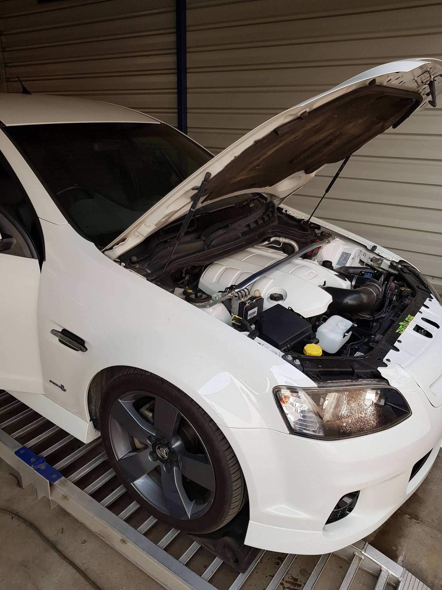 A Close Up Of A White Car Engine  — Dynolink In Garbutt, QLD
