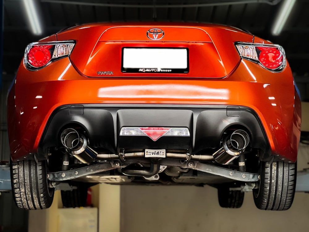 The Rear End Of An Orange Toyota Sports Car Is Shown — Dynolink In Garbutt, QLD