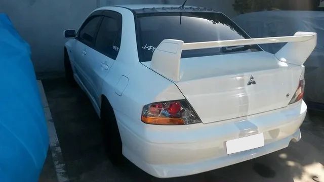 A White Car With A License Plate That Says 066 Tgo — Dynolink In Garbutt, QLD