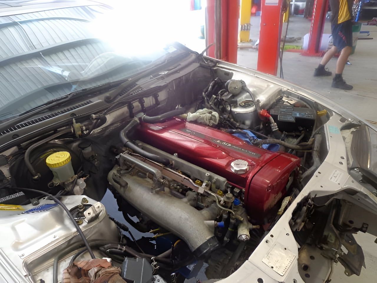 A Car Engine Is Being Worked On In A Garage — Dynolink In Garbutt, QLD