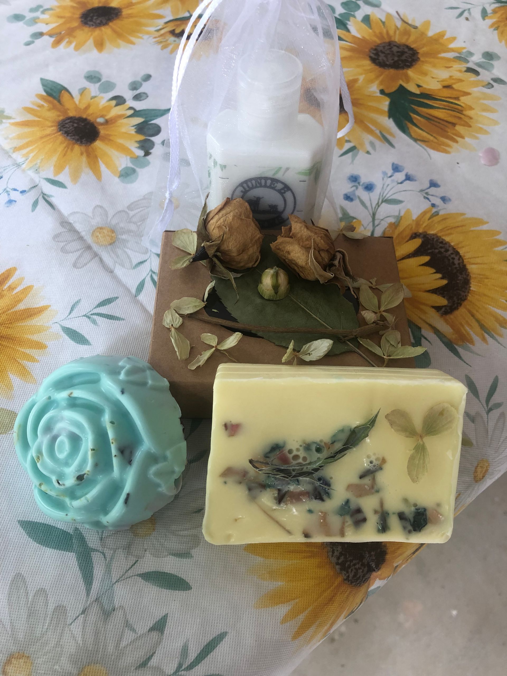Three white soap bars are stacked on top of each other on a white surface.