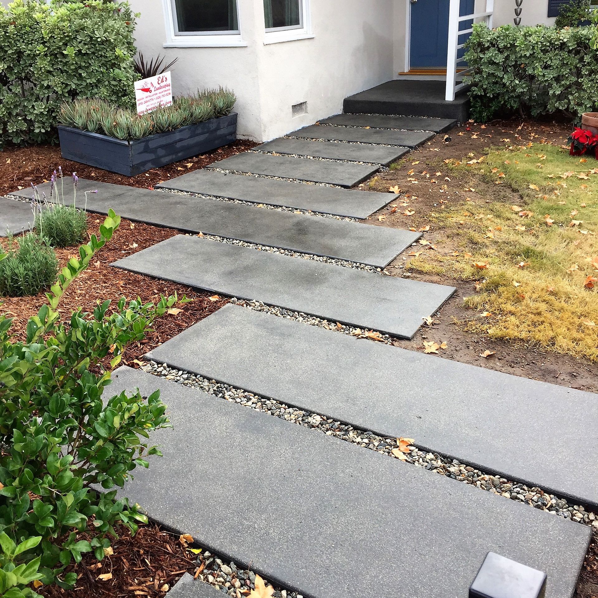 A walkway leading to the front door of a house
