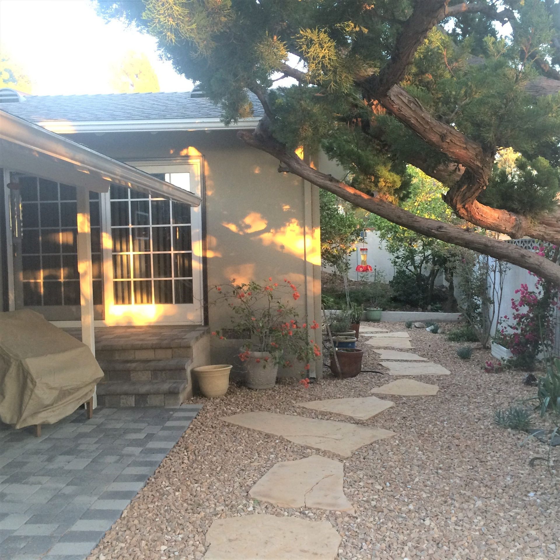 A house with a stone walkway leading to it
