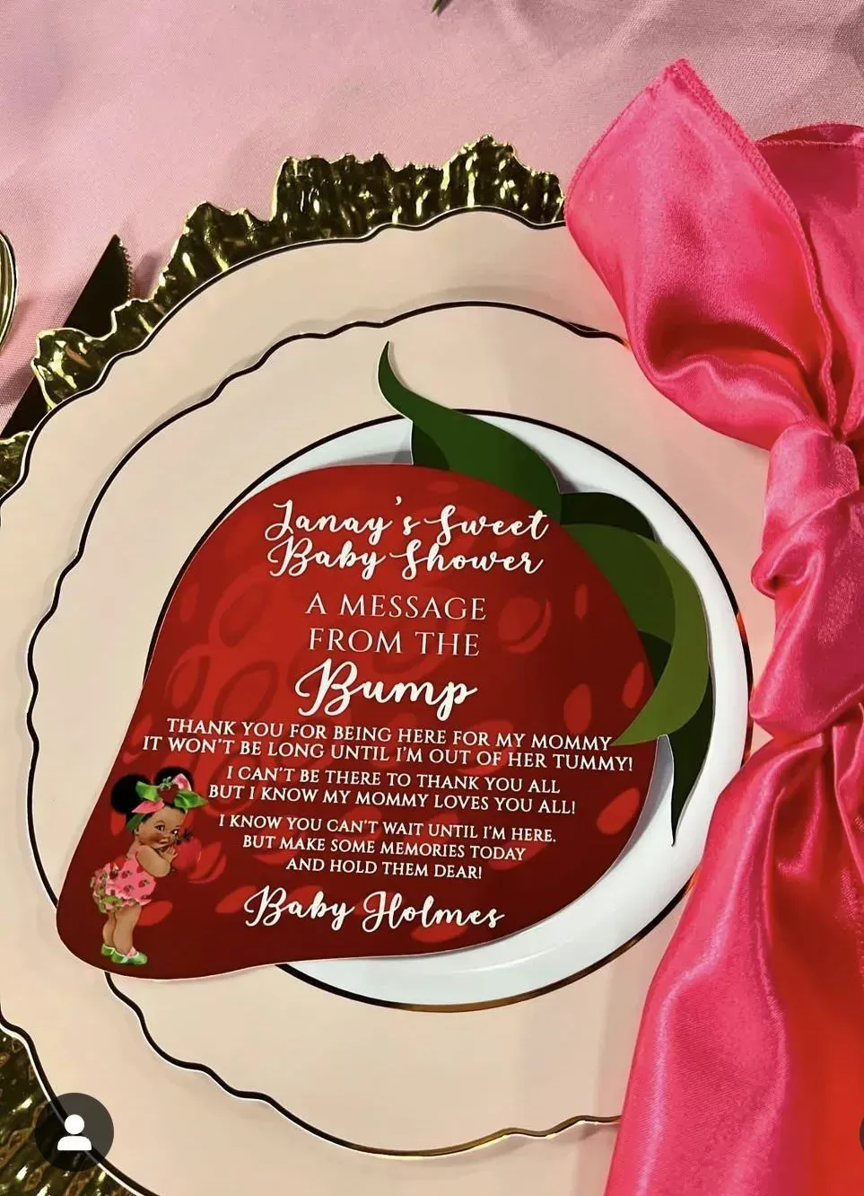 Pink floral memorial card on cream paper with red floral wreath and ribbon.