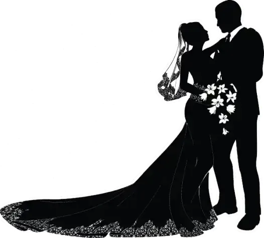 Silhouette of a bride and groom embracing, bride in a long veil and gown with floral accents