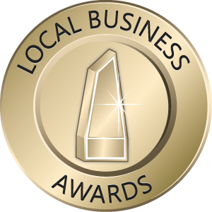 A gold coin that says local business awards